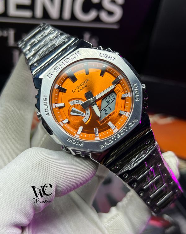 2661619974736935 G-SHOCK GA2100 SILVER CHAIN ORANGE DIAL - Image 1